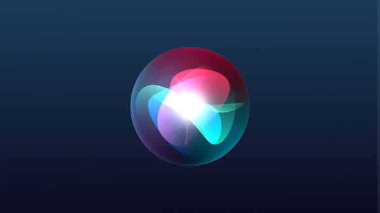 A glowing, multicolored orb with overlapping blue, green, and red light shapes floats on a dark blue gradient background, evoking a digital or futuristic interface—perfect for showcasing iOS 27 at WWDC26.