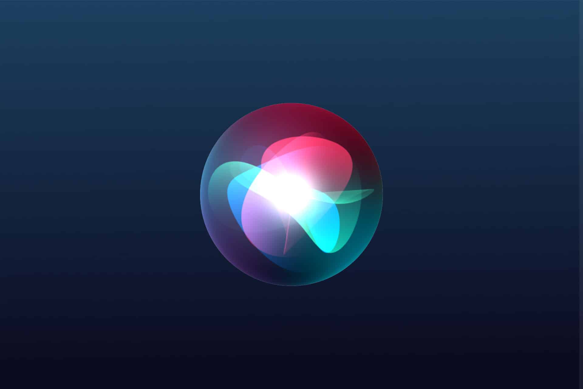 A glowing, multicolored orb with overlapping blue, green, and red light shapes floats on a dark blue gradient background, evoking a digital or futuristic interface—perfect for showcasing iOS 27 at WWDC26.