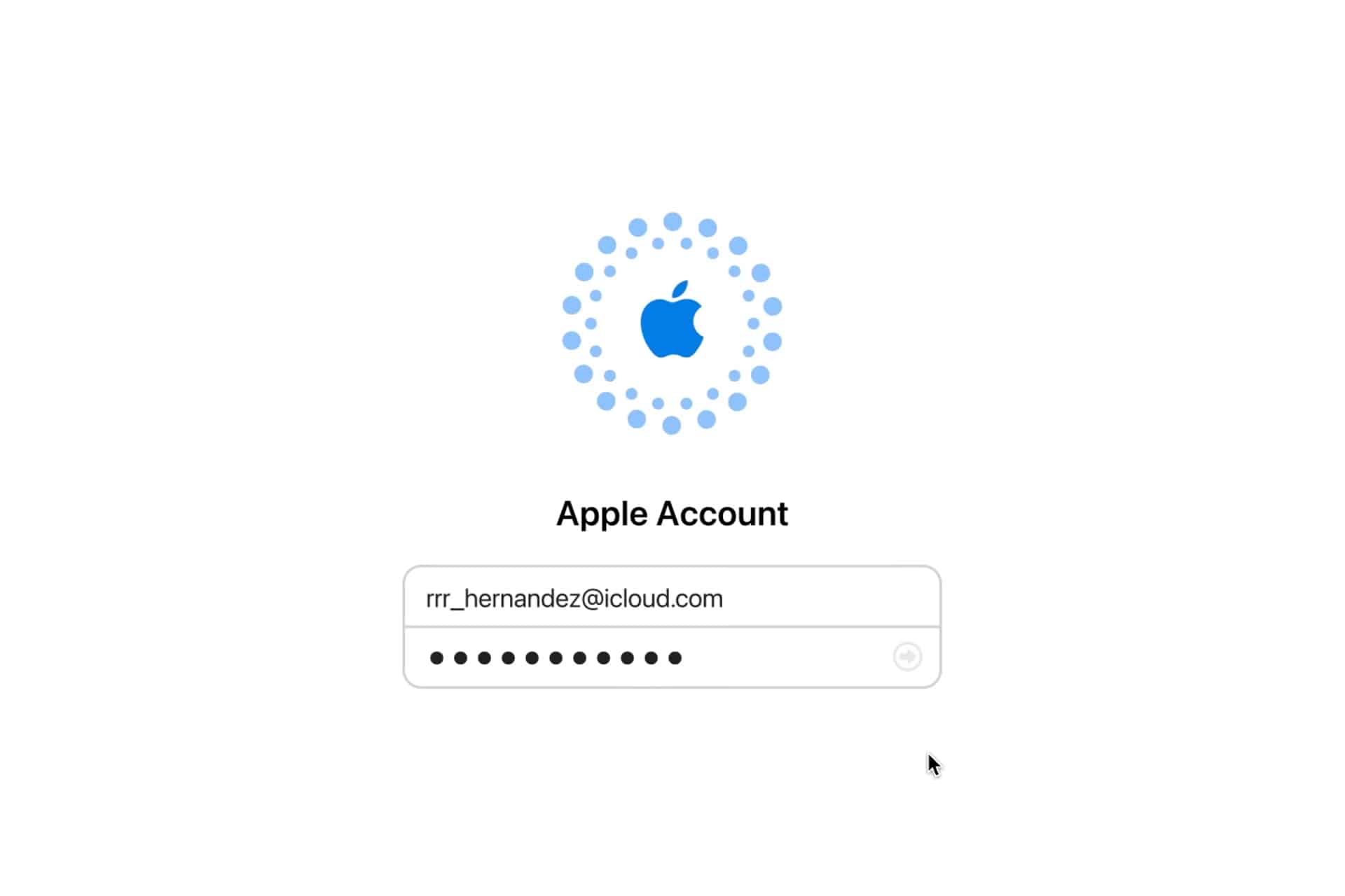 Login screen for an Apple Account recovery, featuring the Apple logo above a username field filled with "rr_hernandez@icloud.com" and a password field with hidden characters. A mouse pointer hovers near the bottom right.
