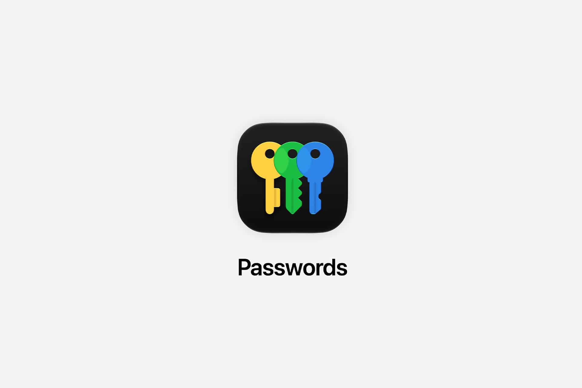 App icon with three keys in yellow, green, and blue on a black rounded square background. Below the icon is the word "Passwords" in black text on a light gray background, highlighting this Passwords app for enhanced iPhone security.