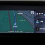 A car dashboard screen with CarPlay features displays navigation directions on I-280 North, estimated arrival in 42 minutes, music playback controls, and a calendar reminder for a FaceTime call with Mom from 10:00 to 11:00 AM.