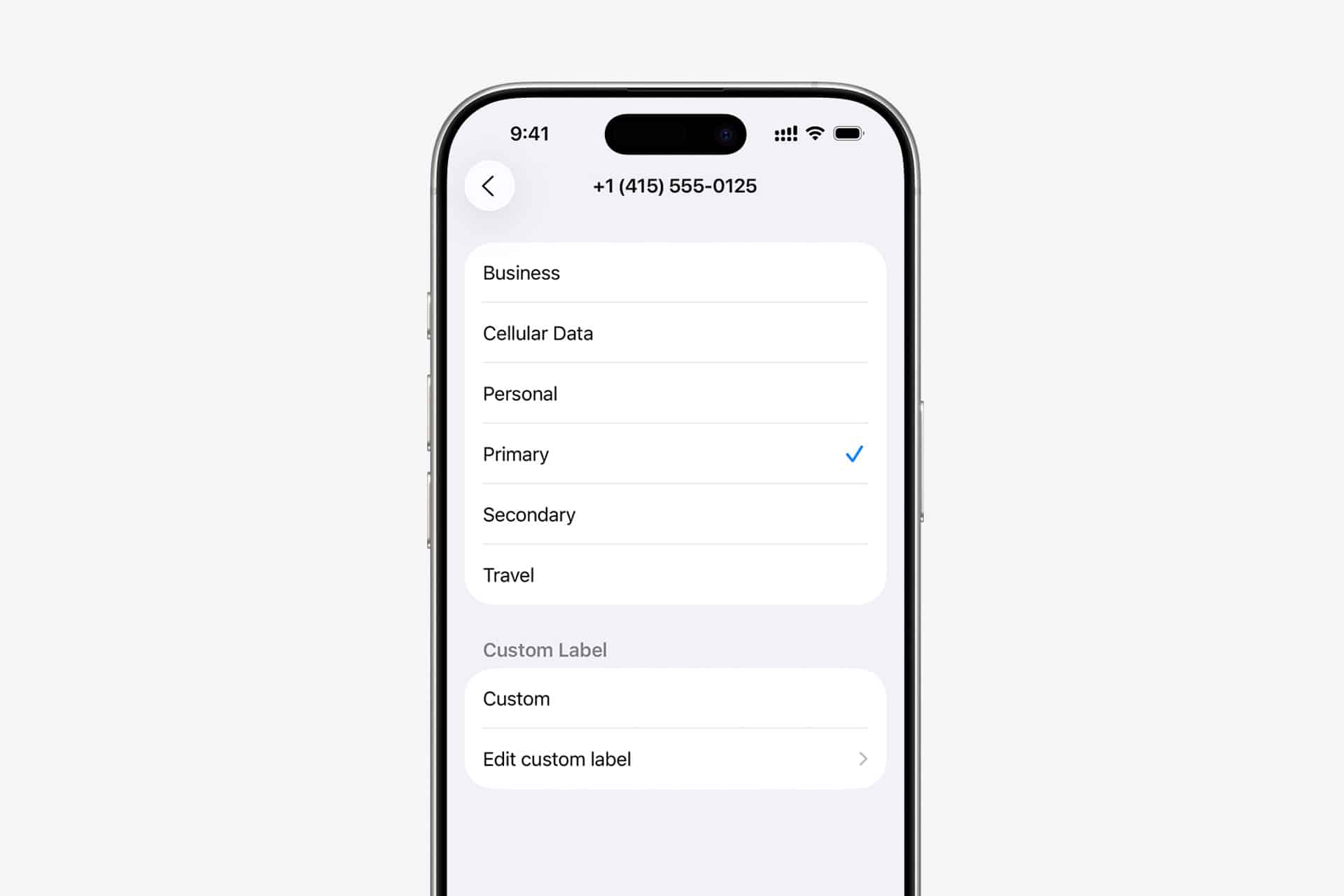 A smartphone screen displays contact label options, including Business, Cellular Data, Personal, Primary (selected), Secondary, Travel, and Custom Label—ideal for managing iPhone eSIM and personal line phone numbers.