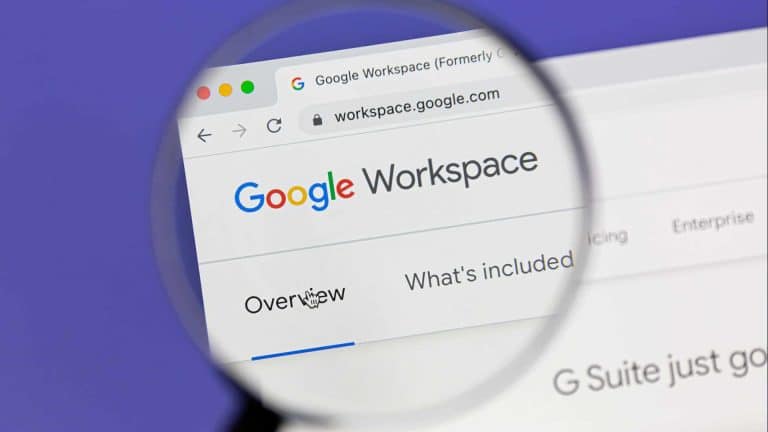 A magnifying glass focuses on the Google Workspace website in a web browser, highlighting the words “Overview” and “What’s included,” as Google Docs features are explored on a Mac.