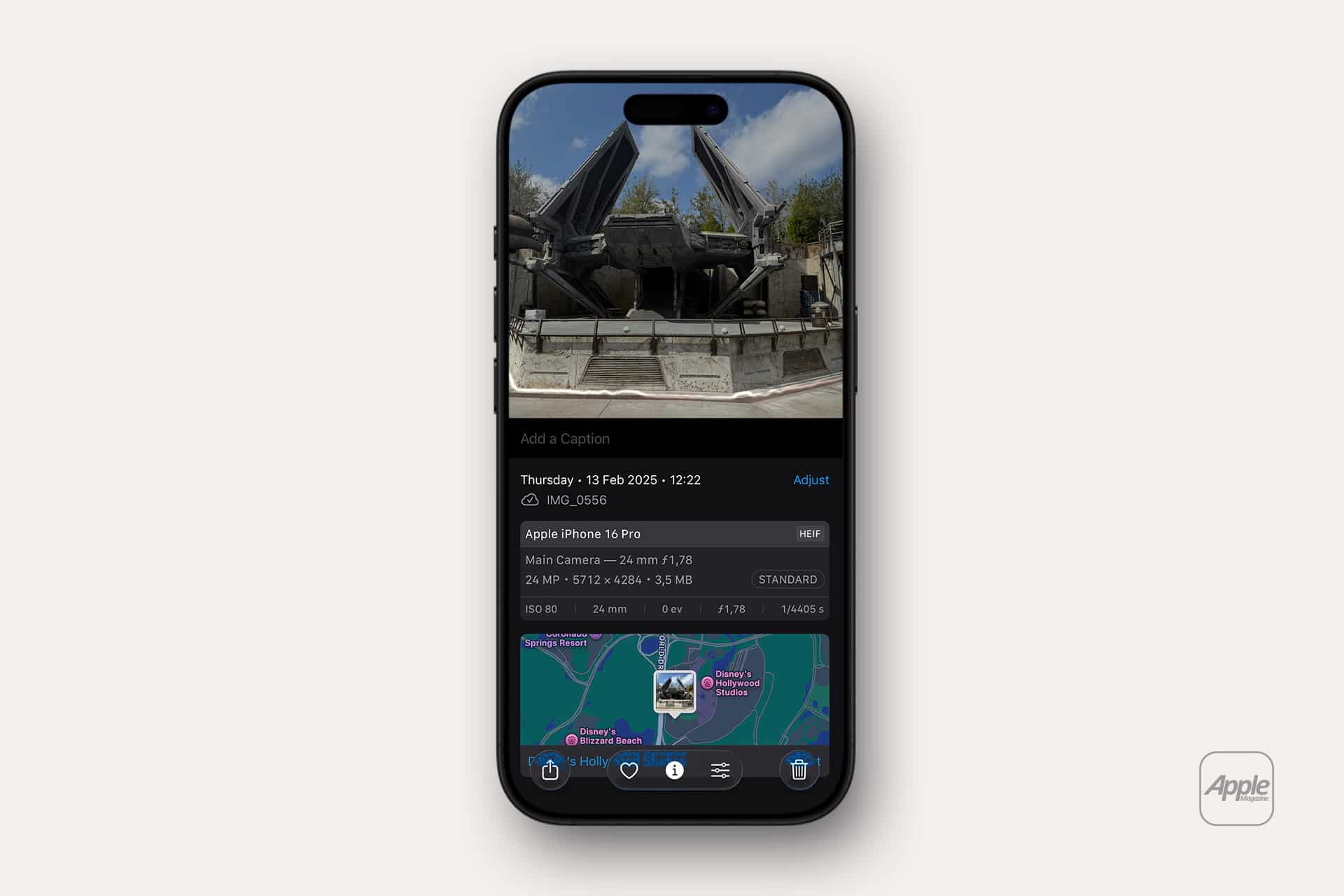 A smartphone screen displays a photo of a futuristic black spacecraft on a concrete platform, with image details and a map location below. iCloud Photos organizes the image, and the Apple logo appears in the bottom right corner.