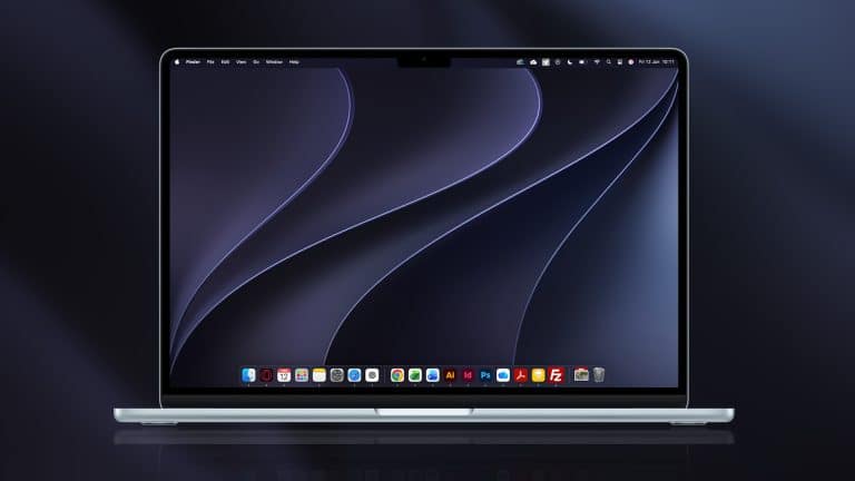 A silver laptop powered by Apple silicon displays a dark abstract wallpaper with curved lines. Running macOS 27 Golden Gate, its screen shows several application icons along the bottom dock, with a blurred background in dark shades.
