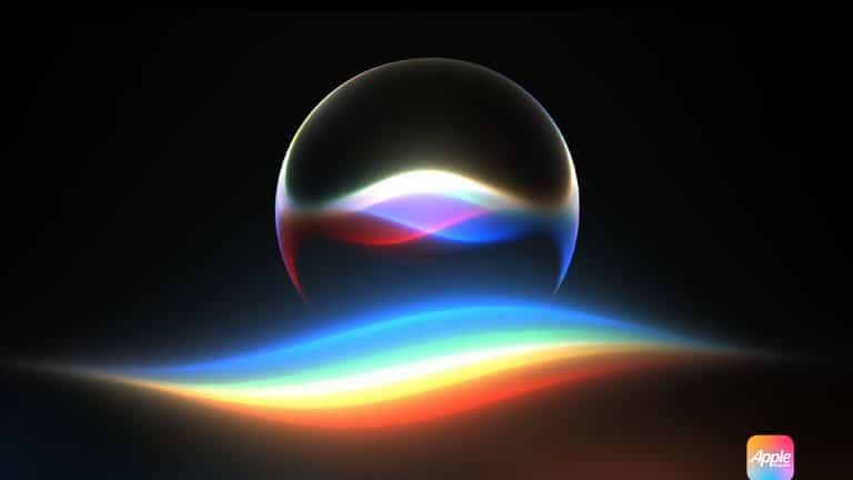 A glowing, multicolored wave and orb on a dark background, resembling Apple’s Siri icon, with a small Apple logo in the bottom right corner.
