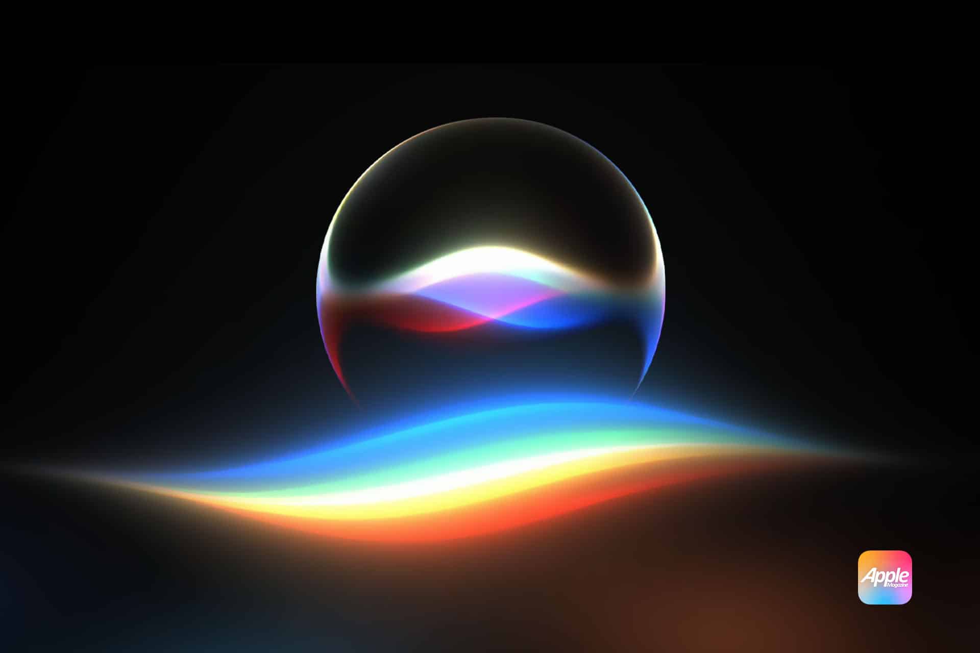 A glowing, multicolored wave and orb on a dark background, resembling Apple’s Siri icon, with a small Apple logo in the bottom right corner.
