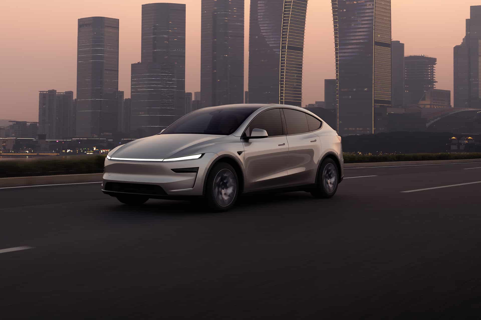 A sleek, modern white Tesla electric SUV drives on an empty highway at dusk, with tall glass skyscrapers and a hazy sky in the background. CarPlay route sharing enhances the connected driving experience.