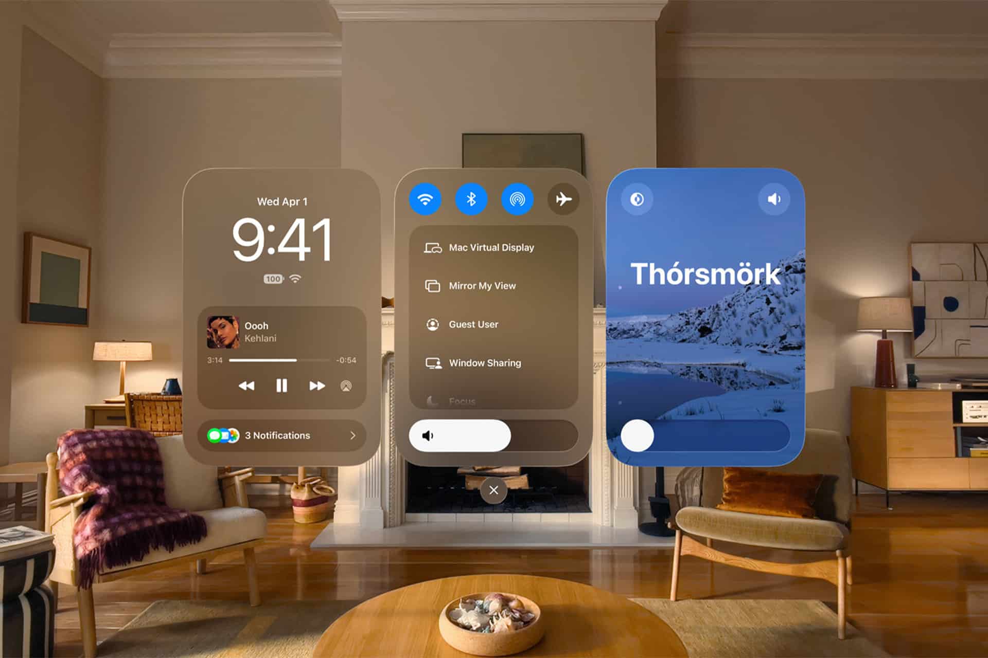 A cozy, modern living room with warm lighting and wooden furniture, overlaid with three floating visionOS 27 interface screens on Apple Vision Pro displaying music, settings, and a scenic photo labeled "Thórsmörk.