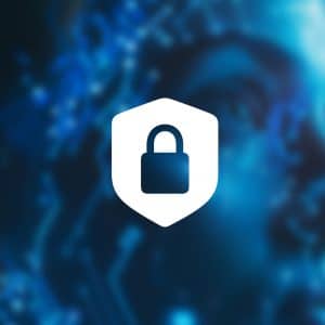 A white padlock inside a shield icon appears over a blue, futuristic digital face with circuit patterns. The Apple logo is in the lower right corner. The image suggests cybersecurity and technology protecting against AI hacking.
