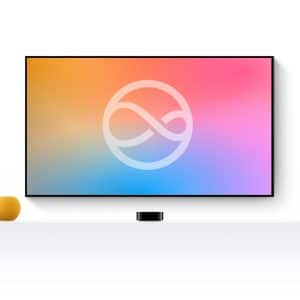 A flat-screen TV with a colorful gradient display and an abstract infinity symbol is mounted on a white wall. Below, a white shelf holds a small yellow sphere and the sleek Next-Gen Apple TV device.