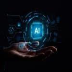 A hand is held open against a dark background, with a glowing digital illustration of a microchip labeled "AI" and various technology icons floating above the palm—capturing the innovation Apple developers bring from Xcode to the App Store Review process.