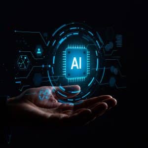 A hand is held open against a dark background, with a glowing digital illustration of a microchip labeled "AI" and various technology icons floating above the palm—capturing the innovation Apple developers bring from Xcode to the App Store Review process.
