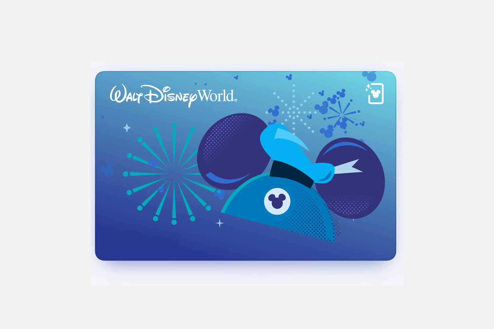 A blue Walt Disney World card featuring Mickey Mouse ears with a sorcerer’s hat, surrounded by fireworks and sparkles on a blue gradient background—perfect for adding to your Apple Wallet on iOS 27.