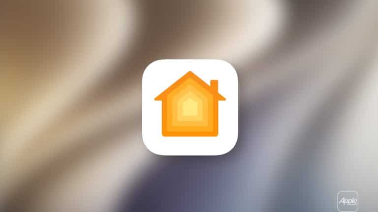 A white rounded square icon with an orange and yellow house symbol appears on a blurred background, representing Apple Home. The Apple logo is visible in the bottom right corner.
