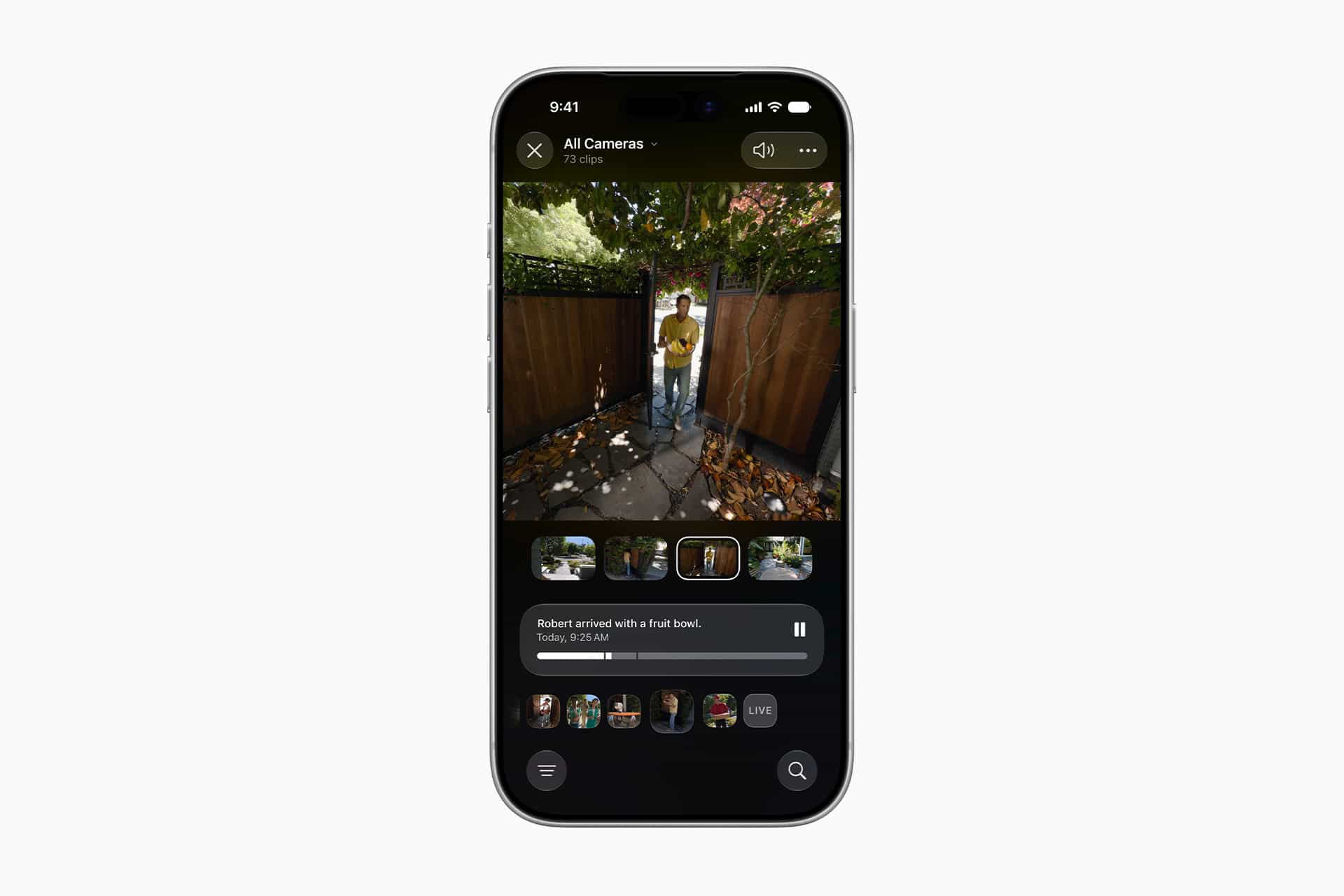 A smartphone displays a security camera app with footage of a person at an outdoor gate. The screen, enhanced by home camera AI, shows video thumbnails and a notification about someone arriving with a package.