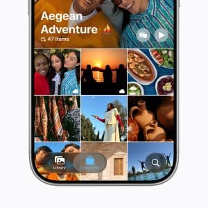 A smartphone screen displays a photo album titled "Aegean Adventure" in the Photos app, with 47 items. A grid of colorful thumbnails—enhanced by iOS 27 AI photo editing—shows people smiling, sunsets, food, pottery, and scenic outdoor views.