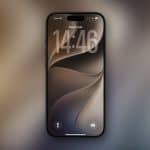 A modern smartphone displaying the lock screen with the time "14:46" and date "Tue 9 Jun." The background showcases abstract, swirling shapes in neutral colors, inspired by WWDC26 wallpapers. The Apple logo appears in the bottom right corner.
