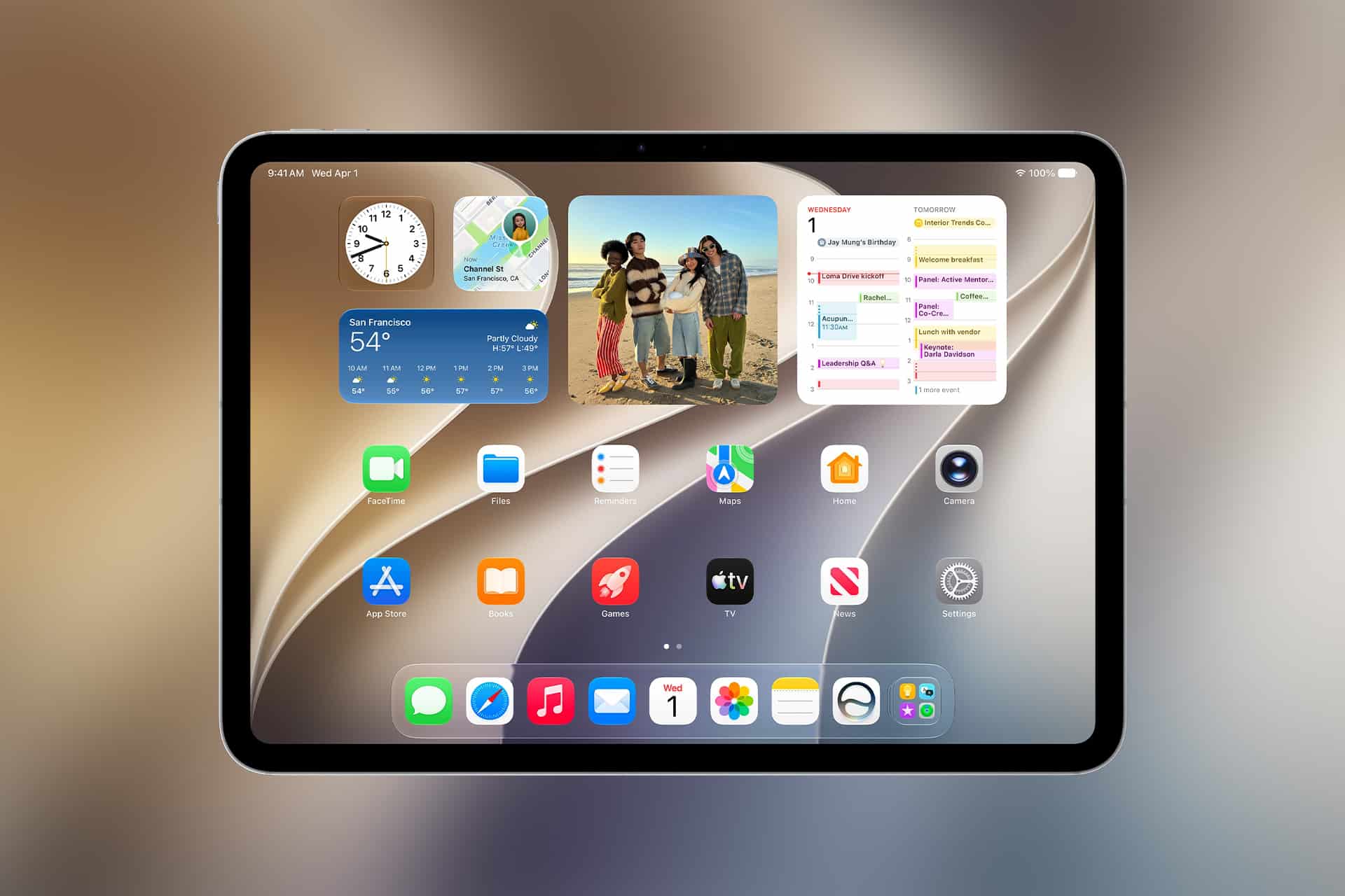 A tablet running iPadOS 27 displays a home screen with widgets for weather, photos, and calendar, plus neatly arranged app icons on a stylish abstract background—showcasing features unveiled at WWDC26.