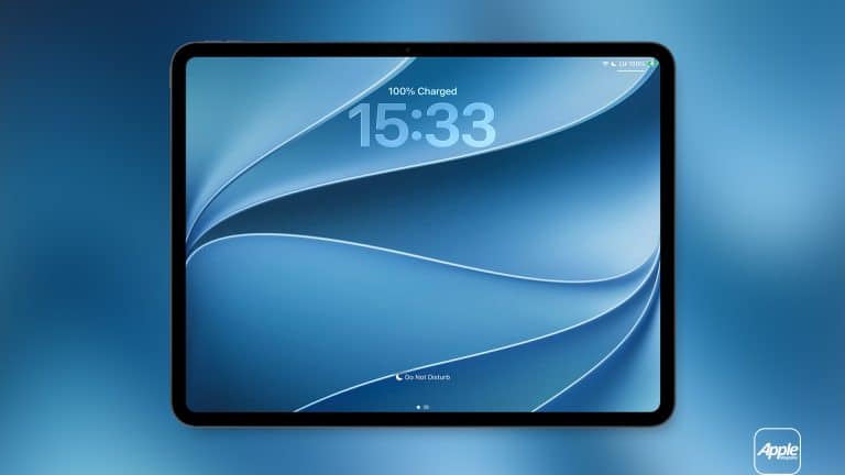 A tablet with a blue abstract iPad wallpaper displays a time of 15:33 and shows 100% battery charged. The background is a blue gradient, and an Apple logo is visible in the bottom right corner.