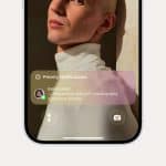 An iPhone Focus notification overlay appears on a smartphone screen, displaying a message from Elena Lanot: "Requesting help with choreography transitions tonight." The background shows a person in a white turtleneck.