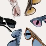 A variety of stylish sunglasses in different colors and lens tints, inspired by the sleek aesthetics of Vision Pro, are arranged in a circular pattern on a white background, with frames in black, blue, brown, pink, and translucent shades.