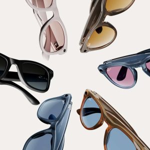 A variety of stylish sunglasses in different colors and lens tints, inspired by the sleek aesthetics of Vision Pro, are arranged in a circular pattern on a white background, with frames in black, blue, brown, pink, and translucent shades.