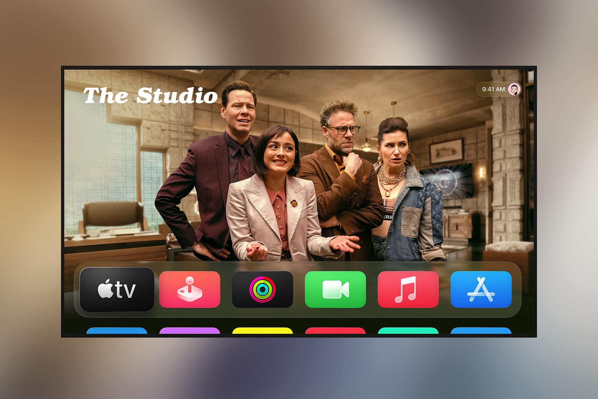 A TV screen displays four people in an office scene labeled "The Studio," with Apple TV 4K and tvOS 27 app icons—including TV, photos, music, and App Store—appearing in a colorful row at the bottom.