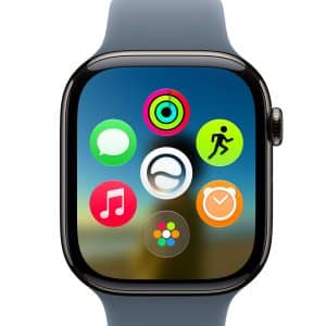 A close-up of a smartwatch screen displaying colorful app icons, including activity rings and music, with a blurred scenic background. The watch features a blue strap and highlights watchOS 27 compatibility.