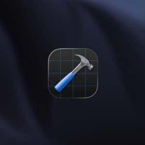 A digital icon of a hammer with a blue handle over a black grid background is centered on a dark, blurred surface. The Apple logo and "Apple" with "WWDC26" appear in the lower right corner, hinting at exciting news for Apple developers.