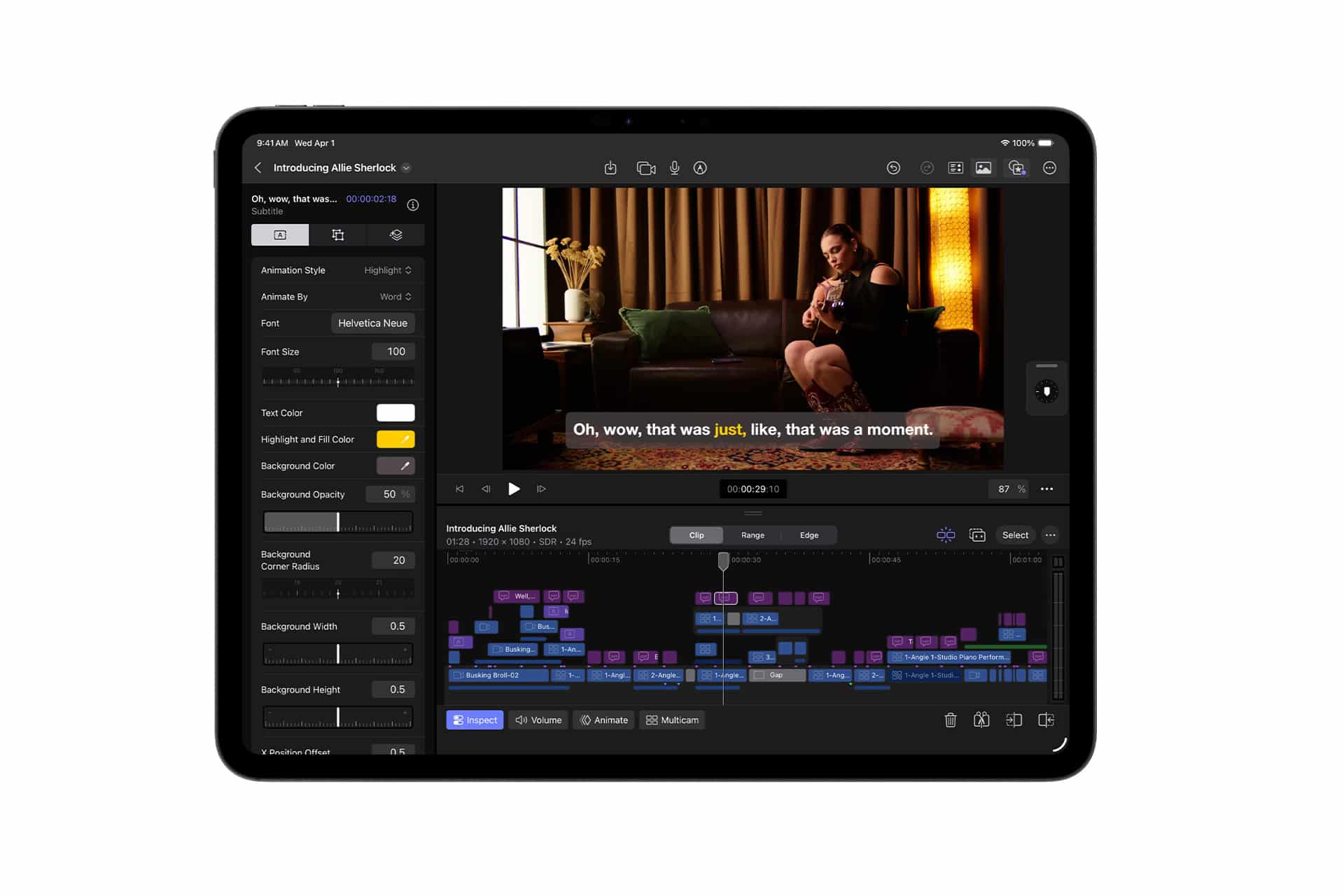 A tablet displays a video editing app—similar to Apple Creator Studio—with a woman playing guitar on screen and subtitles reading, "Oh, wow, that was just, like, that was a moment." Editing tools and timeline appear below the video preview.