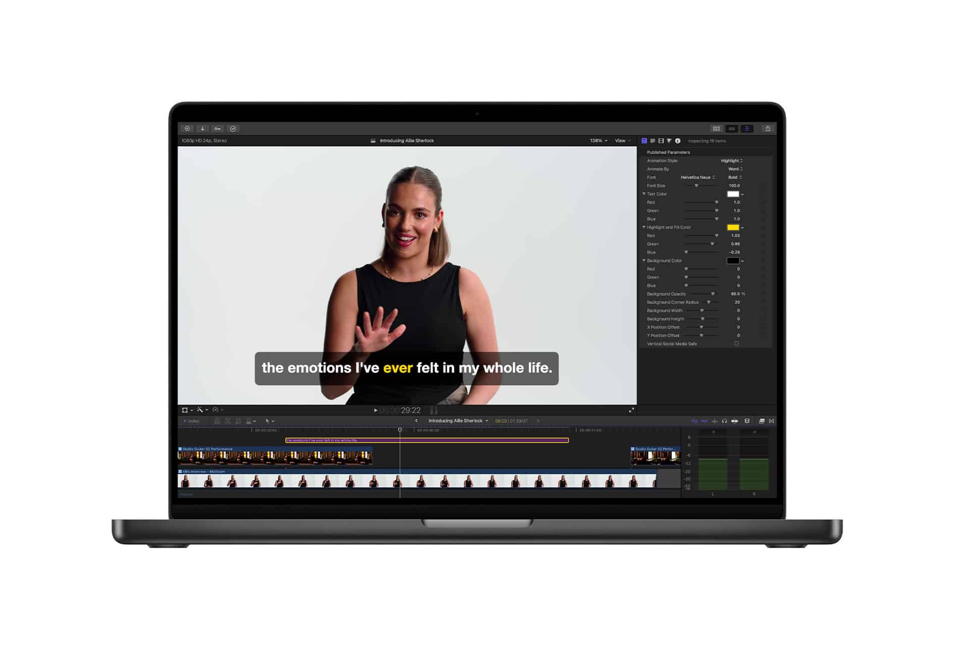 A laptop screen displays Apple video editing software with a paused video of a woman in a black top, gesturing and smiling. The subtitle reads, "the emotions I've ever felt in my whole life," resembling a Keynote presentation style.