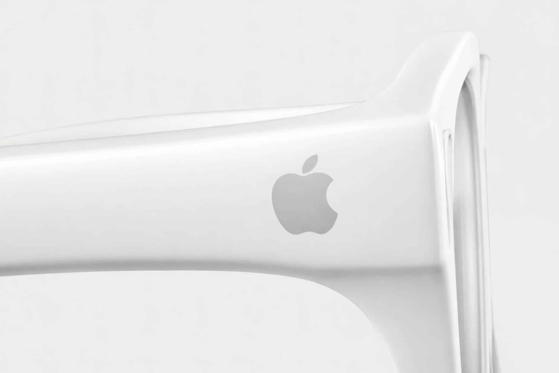 Close-up of the arm of a white pair of Apple Glasses featuring the silver Apple logo against a plain, light background.