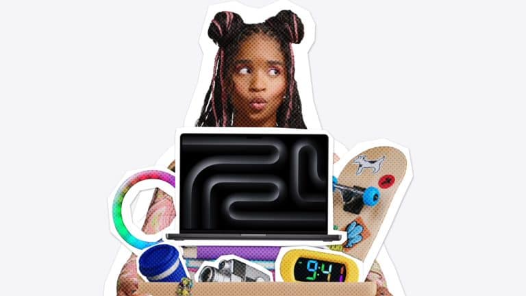A person with space buns holds a box filled with various items, including a laptop, skateboard, clock, camera, and colorful toys, on a plain light background—capturing the excitement of Back to School season and the rush to catch Apple student deals before the Apple Back to School deadline.