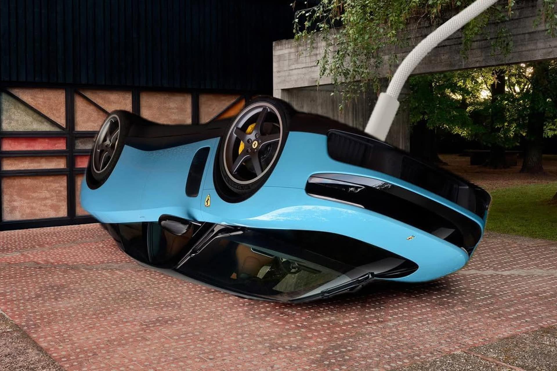 A blue sports car is flipped upside down on a brick driveway, with a white charging cable plugged into it—reminiscent of an experimental OpenAI device. Trees and a modern building are in the background.
