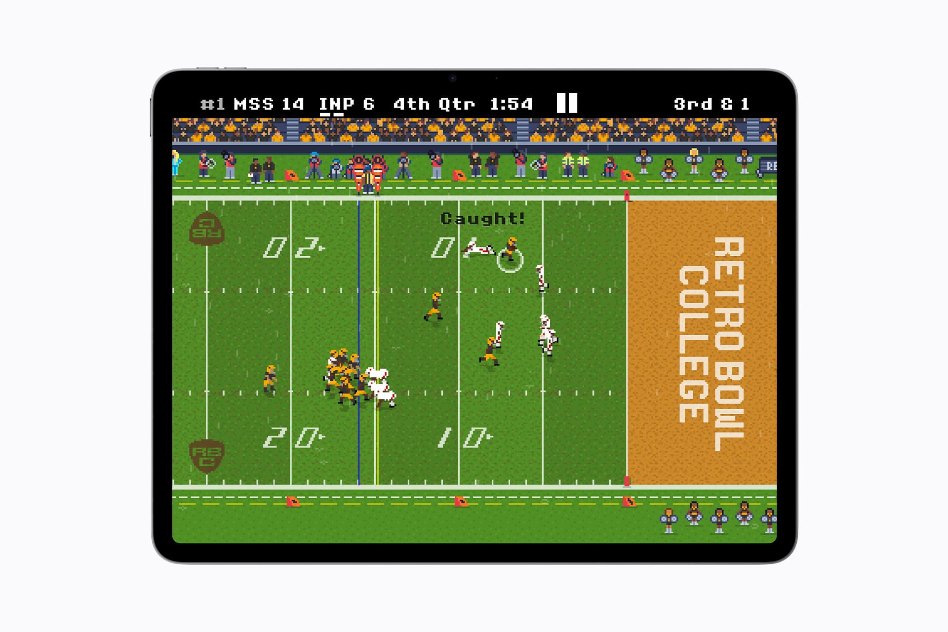 A tablet screen shows a pixelated football video game, "Retro Bowl College," reminiscent of classic titles but with the charm of modern offerings like those found on Apple Arcade. One team is about to score a touchdown, with "Caught!" displayed above the players on the field. Game stats are visible at the top.