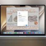 A MacBook screen displays a Safari browser window with a summer camp website and a pop-up notification prompt for Safari alerts, set against a neutral gradient background with a small Apple logo in the corner.