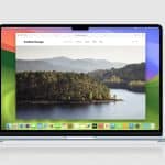 A MacBook displays a website called “Another Escape” featuring a scenic lake and forest landscape, open in Safari. The desktop has a colorful abstract wallpaper and app icons—including Safari MCP Server—along the dock at the bottom of the screen.