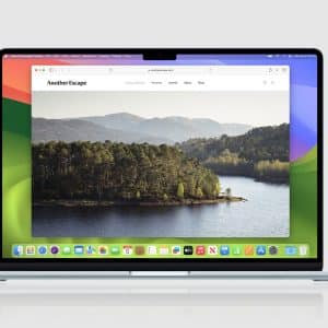 A MacBook displays a website called “Another Escape” featuring a scenic lake and forest landscape, open in Safari. The desktop has a colorful abstract wallpaper and app icons—including Safari MCP Server—along the dock at the bottom of the screen.