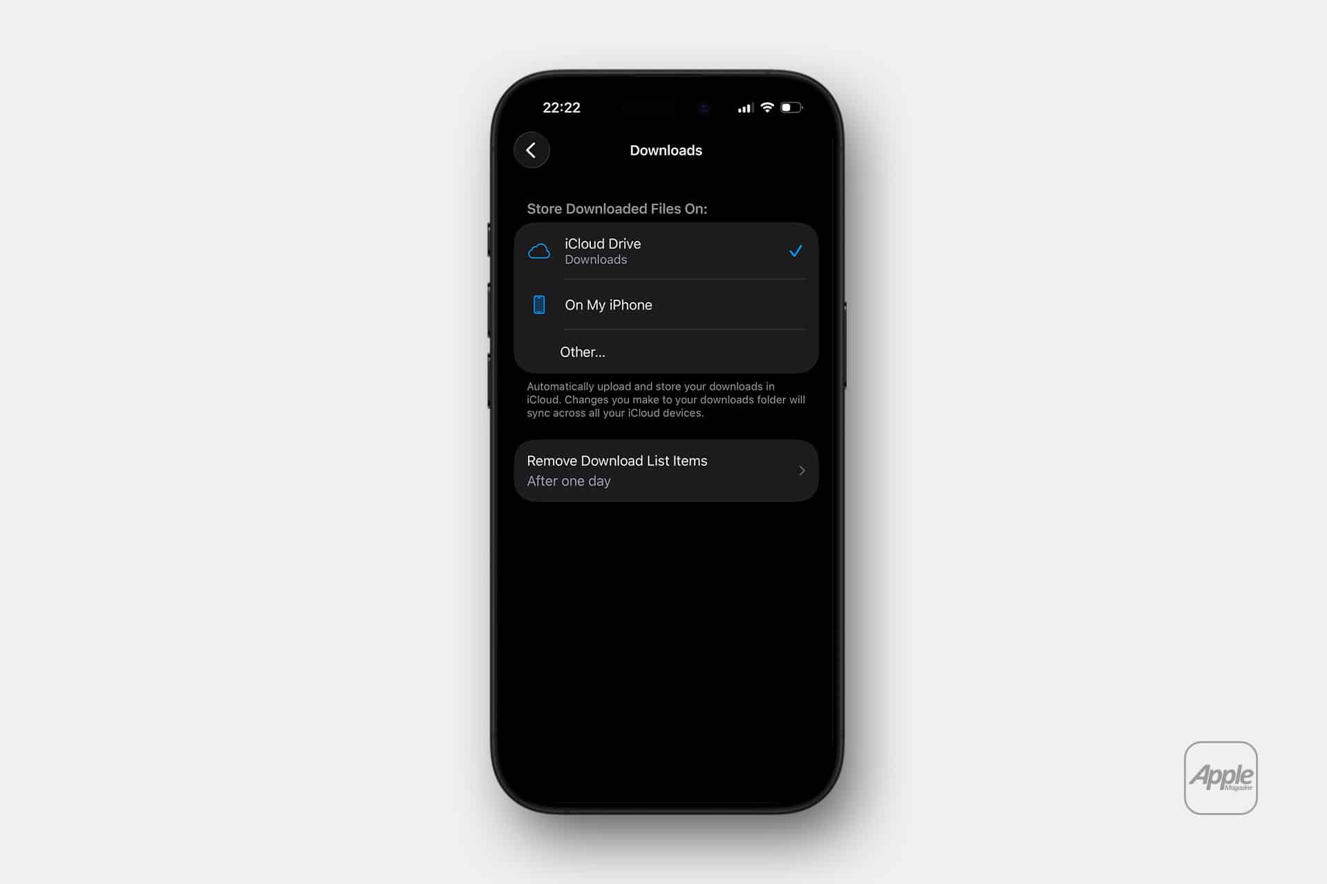 An iPhone displays the Downloads settings screen, showing options to store downloaded files on iCloud Drive, on the iPhone, or another location using the Files app. The Apple logo is in the bottom right corner, highlighting how easy it is to manage your files after switching from Android to iPhone.
