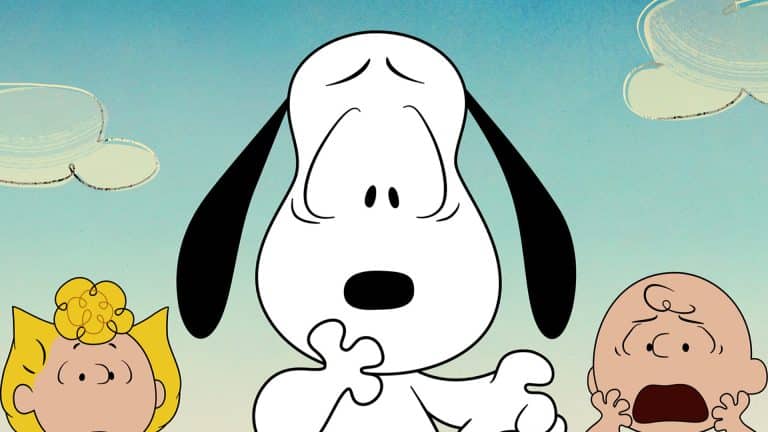 Snoopy looks surprised with one paw up, while Sally and Charlie Brown stand on either side, both appearing shocked. Set against a blue sky with simple clouds, this scene perfectly captures the whimsical charm of a classic Peanuts special as seen in Snoopy Presents on Apple TV.