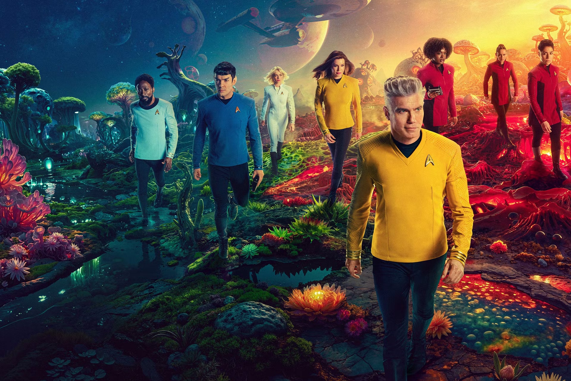 A group of people in colorful Star Trek uniforms walk through a vibrant, alien landscape with glowing plants, rocky terrain, and futuristic spaceships soaring above—ready for discovery as seen in stunning 4K upgrades on the Apple TV app.