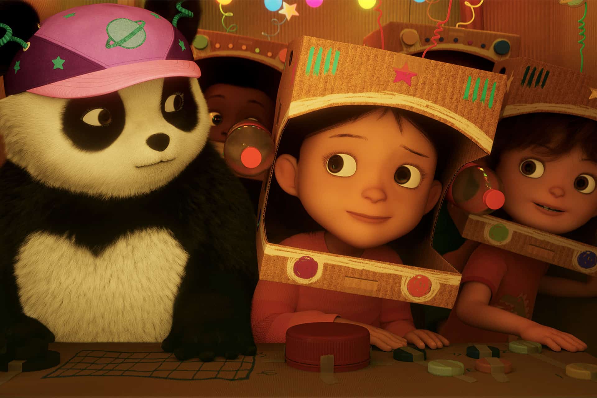 A panda and two kids wearing cardboard space helmets sit at a control panel, surrounded by colorful decorations and lights, looking at each other and smiling—capturing the imaginative spirit of the animated series Stillwater season 5 on Apple TV.