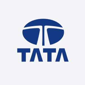 Blue Tata logo with a stylized "T" inside a circle above the word "TATA" in bold, uppercase blue letters on a light gray background, representing Tata Electronics amidst recent headlines about the Tata data leak.