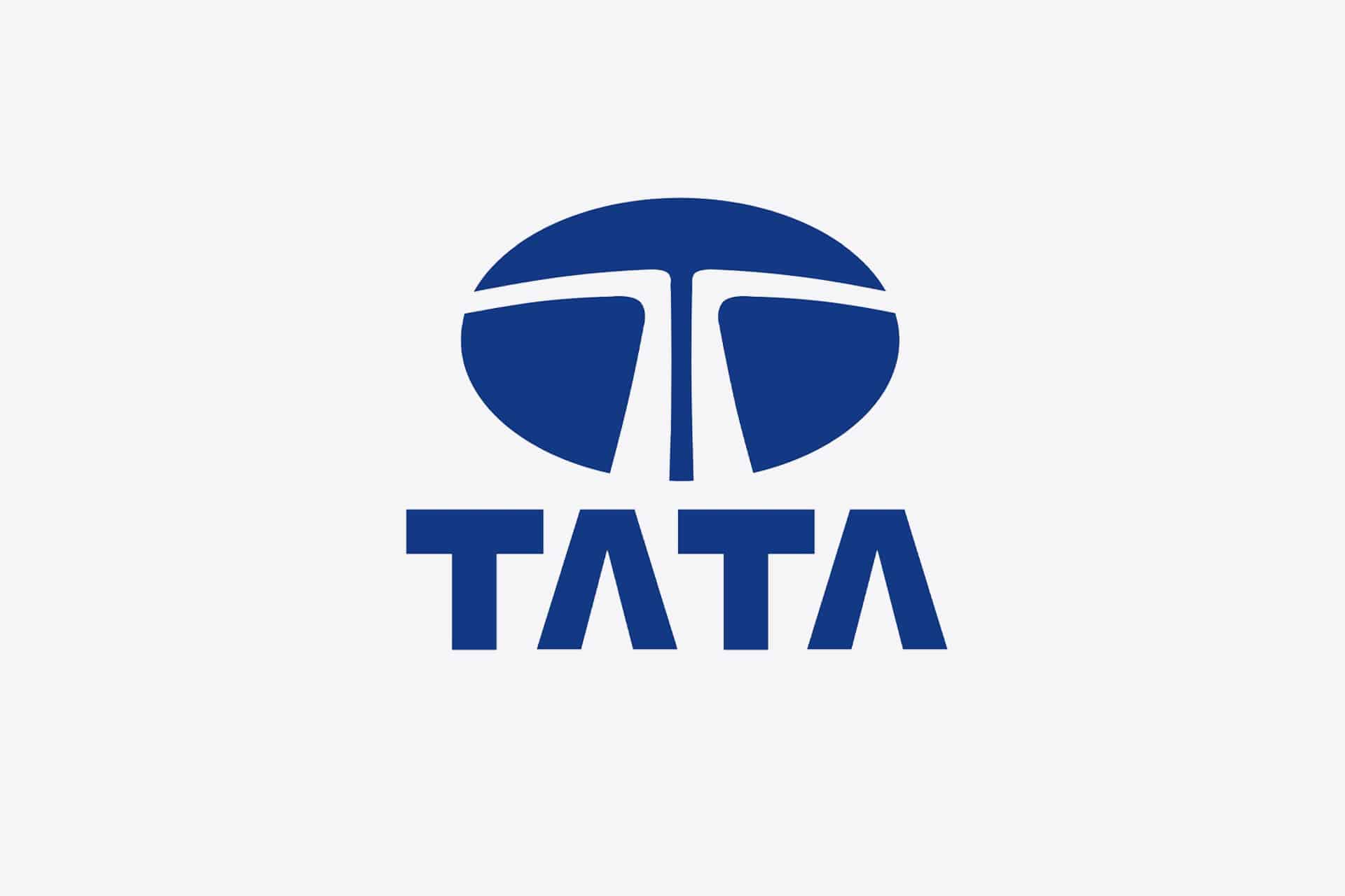 Blue Tata logo with a stylized "T" inside a circle above the word "TATA" in bold, uppercase blue letters on a light gray background, representing Tata Electronics amidst recent headlines about the Tata data leak.