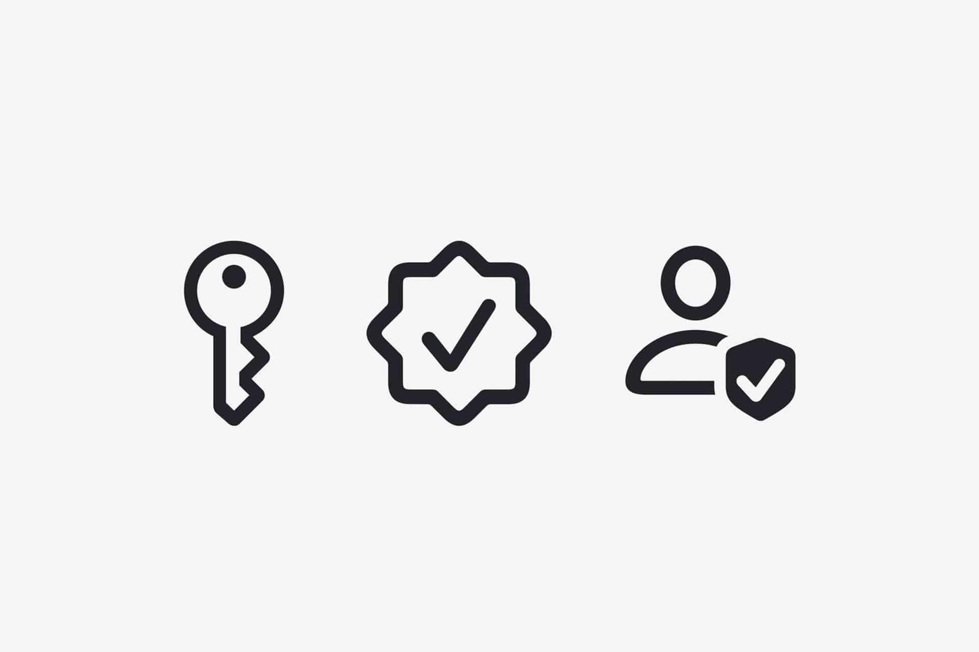 Three black icons on a light gray background: a key, a checkmark badge, and a person with a shield featuring a checkmark. The icons reflect scam detection, security, and user protection—key themes in iOS 27 Trust Insights.