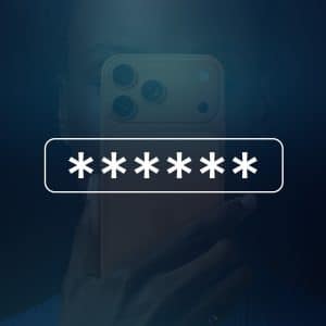 A person holds a smartphone in front of their face, partially obscured by a row of asterisks representing a password. The Apple logo is visible in the lower right corner, hinting at iPhone verification codes appearing via iOS autofill.