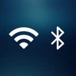 White Wi-Fi and Bluetooth icons on a dark blue gradient background, with a small Apple logo in the bottom right corner—an elegant nod to Apple’s Ecosystem, seamlessly connecting your devices through Wi-Fi and Bluetooth for effortless AirPlay experiences.