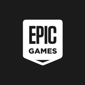 Epic Games logo featuring the words "EPIC GAMES" in bold, white capital letters on a black background, inside a white shield-shaped emblem—a symbol often seen amid debates over App Store fees.