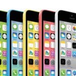 Five iPhones in green, blue, yellow, pink, and white are displayed side by side, each showing their home screens with app icons and the same time and date—a colorful nod to legacy iPhone models and their enduring appeal among enthusiasts interested in iOS signing or exploring features on older iPads.
